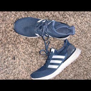 Navy blue adidas ultra boost running shoes.